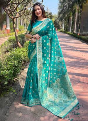 Looking These Party Wear Saree in Fine Colored.These Saree And Blouse is Fabricated On Organza.Its Beautified With Weaving Floral Designer.