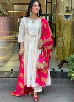 Garb These Suit in Fine Colored Pair With Bottom And Dupatta.These Top Are Cotton Silk And Bottom Are Fabricated On Cotton Silk Pair With Jacquard Silk Dupatta.Its Beautified With Designer Embroidery Work.