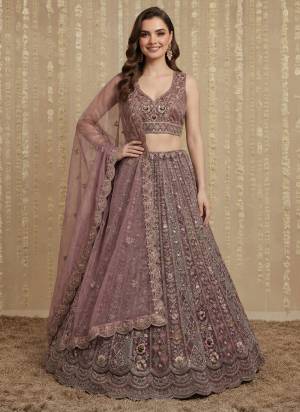 For A Fancy Designer Look,Grab These Lehenga Choli With Dupatta in Fine Colored.These Lehenga And Choli Are Net And Dupatta Are Fabricated On Organza Pair.Its Beautified With Fancy Dori, Sequance,Jari,Thread Embroidery,Zarcon Diamond Work. 