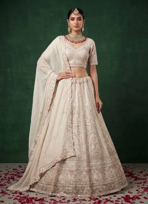 For A Fancy Designer Look,Grab These Lehenga Choli With Dupatta in Fine Colored.These Lehenga And Choli Are Satin And Dupatta Are Fabricated On Satin Pair.Its Beautified With Fancy Dori, Sequance Embroidery,Crystal Pipe Hand Work. 
