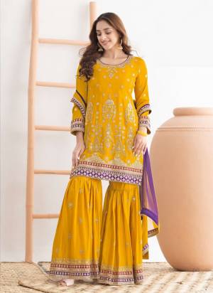 Garb These Designer Sharara Suit in Fine Colored Pair With Bottom And Dupatta.These Top Are Chinon And Dupatta Are Fabricated On Chinon Pair With Chinon Bottom.Its Beautified With Crepe Inner.Its Beautified With Heavy Designer Embroidery Work.