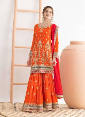 Garb These Designer Sharara Suit in Fine Colored Pair With Bottom And Dupatta.These Top Are Chinon And Dupatta Are Fabricated On Chinon Pair With Chinon Bottom.Its Beautified With Crepe Inner.Its Beautified With Heavy Designer Embroidery Work.