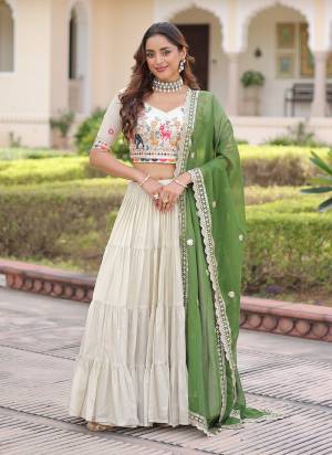 Looking These Party Wear Lehenga Choli in Fine Colored. These Lehenga And Blouse Are Cosmos Silk And Dupatta Are Fabricated On Tabby Silk Fabriced. It is Beautified With Designer Jari,Multy Thread Embroidery Work.