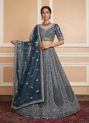 For A Fancy Designer Look,Grab These Lehenga Choli With Dupatta in Fine Colored.These Lehenga And Choli Are Net And Dupatta Are Fabricated On Net Pair.Its Beautified With Fancy Butterfly Motif,Sequance,Multy Thread Embroidery,Heavy Zircon Diamond Work. 