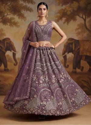 For A Fancy Designer Look,Grab These Lehenga Choli With Dupatta in Fine Colored.These Lehenga And Choli Are Net And Dupatta Are Fabricated On Net Pair.Its Beautified With Fancy Verious Sequance,Multy Thread Embroidery,Flower Beads,Zircon Diamond Work. 