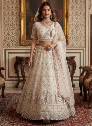 For A Fancy Designer Look,Grab These Lehenga Choli With Dupatta in Fine Colored.These Lehenga And Choli Are Net And Dupatta Are Fabricated On Net Pair.Its Beautified With Fancy Sequance, Thread Embroidery,Flower Beads,Crystal Pipe Hand Work. 