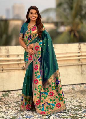 Garb These Party Wear Saree in Fine Colored.These Saree And Blouse is Fabricated On Paithani Silk.Its Beautified With Weaving Polaka Jari, Peacock Paithani Meenakari Pallu Designer.
