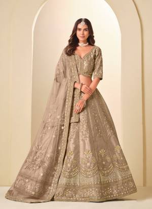 For A Designer Look,Grab These Party Wear Lehenga Choli in Fine Colored.These Lehenga And Blouse Are Fabricated On Art Silk Pair With Net Dupatta.Its Beautified With Designer Embroidery Work.