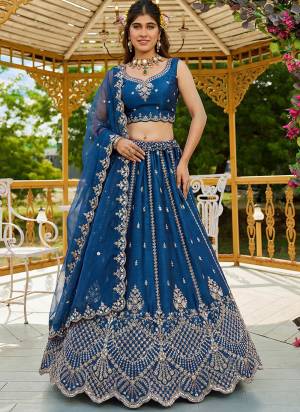 For A Fancy Designer Look,Grab These Lehenga Choli With Dupatta in Fine Colored.These Lehenga And Choli Are Satin And Dupatta Are Fabricated On Organza Pair.Its Beautified With Fancy Rainbow Sequance,Dori Embroidery,Motif And Crystal Hand Work. 