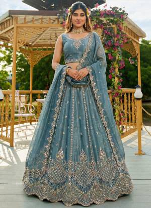 For A Fancy Designer Look,Grab These Lehenga Choli With Dupatta in Fine Colored.These Lehenga And Choli Are Satin And Dupatta Are Fabricated On Organza Pair.Its Beautified With Fancy Rainbow Sequance,Dori Embroidery,Motif And Crystal Hand Work. 