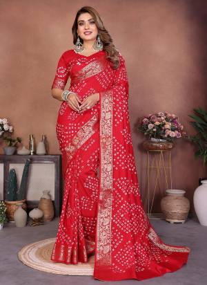 Garb These Festive Party Wear Saree in Fine Colored.These Saree And Blouse is Fabricated On Dola Silk.Its Beautified With Weaving JariBorder Designer With Hand Made Tied Bandhej .