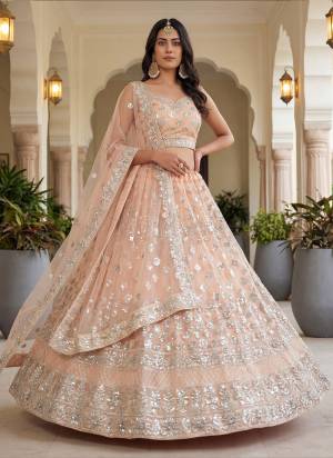 For A Fancy Designer Look,Grab These Lehenga Choli With Dupatta in Fine Colored.These Lehenga And Choli Are Net And Dupatta Are Fabricated On Net Pair.Its Beautified With Fancy Thread,Jari Embroidery Work. 