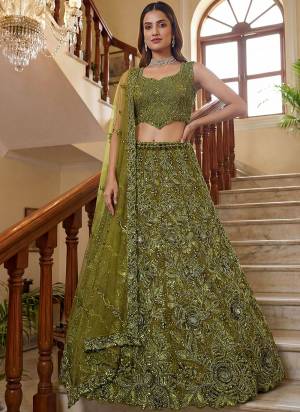 For A Fancy Designer Look,Grab These Lehenga Choli With Dupatta in Fine Colored.These Lehenga And Choli Are Net And Dupatta Are Fabricated On Net Pair.Its Beautified With Fancy Sequance,Thread Embroidery,Crystal Motif,Crystal Pipe Work. 