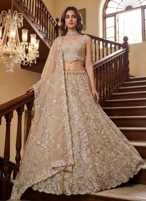 For A Fancy Designer Look,Grab These Lehenga Choli With Dupatta in Fine Colored.These Lehenga And Choli Are Net And Dupatta Are Fabricated On Net Pair.Its Beautified With Fancy Sequance,Thread Embroidery,Crystal Motif,Crystal Pipe Work. 