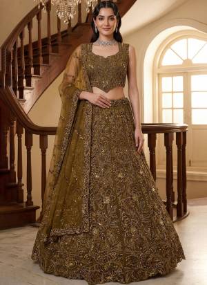 For A Fancy Designer Look,Grab These Lehenga Choli With Dupatta in Fine Colored.These Lehenga And Choli Are Net And Dupatta Are Fabricated On Net Pair.Its Beautified With Fancy Sequance,Thread Embroidery,Crystal Motif,Crystal Pipe Work. 