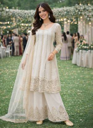  Looking These Party Wear Suit in Free Size Stitched Fine Colored Pair With Bottom And Dupatta.These Top Are Chinon And Dupatta Are Fabricated On Chinon Pair With Chinon Bottom.Its Beautified With Designer Embroidery Work.