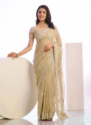 Grab These Party Wear Saree in Fine Colored Pair With Blouse.These Saree Are Tissue and Blouse Are Fabricated On Art Silk.Its Beautified With Designer Embroidery Work.