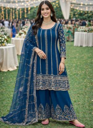  Looking These Party Wear Suit in Free Size Stitched Fine Colored Pair With Bottom And Dupatta.These Top Are Chinon And Dupatta Are Fabricated On Net Pair With Chinon Bottom.Its Beautified With Designer Mirror Embroidery Work.