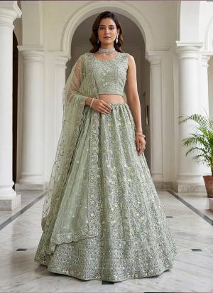 For A Fancy Designer Look,Grab These Lehenga Choli With Dupatta in Fine Colored.These Lehenga And Choli Are Net And Dupatta Are Fabricated On Net Pair.Its Beautified With Fancy Viscous Multy Thread,Double Sequance,Dori Embroidery,Zircon Diamond Work. 