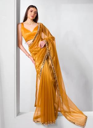 Attractive Look These Party Wear Saree in Fine Colored.These Saree Are Gold Twill Net And Blouse is Gold Twill Net Fabricated.Its Beautified With Designer Real Mirror,Coding Lace Border.