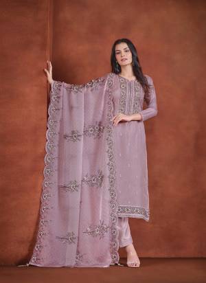 Garb These Party Wear Salwar Suit in Fine Colored Pair With Bottom And Dupatta.These Top And Dupatta Are Fabricated On Lavender Organza Pair With Santoon Bottom.Its Beautified With Designer Embroidery With Zarkan Work.