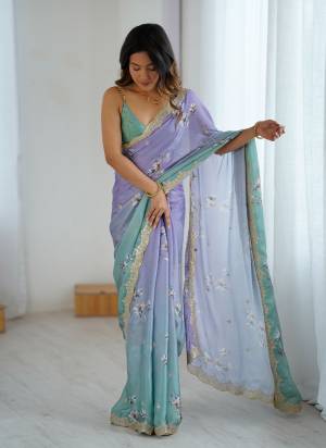 Looking These Party Wear Saree in Fine Pedding Colored.These Saree Are Satin Chiffon And Blouse is Satin Chiffon Fabricated.Its Beautified With Pedding Color With Hand Printed Designer With Sequance,Dori Embroidery Work.