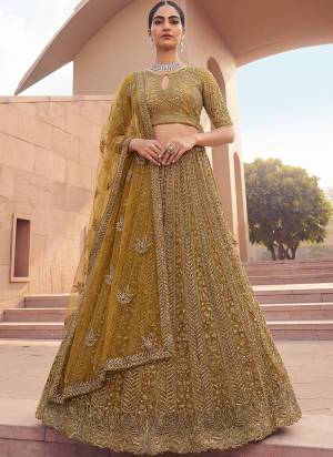 For A Fancy Designer Look,Grab These Lehenga Choli With Dupatta in Fine Colored.These Lehenga And Choli Are Net And Dupatta Are Fabricated On Soft Net Pair.Its Beautified With Fancy Crystal Motif,Thread,Sequance Embroidery,Crystal Pipe Work. 