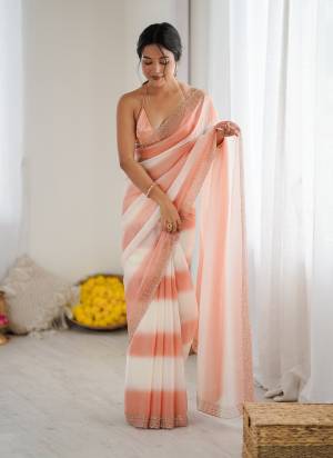 Attractive These Fancy Party Wear Saree in Fine Pedding  Colored.These Saree Are Fendy Satin And Blouse is Ultra Satin Fabricated.Its Beautified With Peding Color,Designer Jarkan Diamond Work Border .