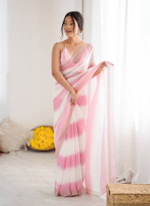 Attractive These Fancy Party Wear Saree in Fine Pedding  Colored.These Saree Are Fendy Satin And Blouse is Ultra Satin Fabricated.Its Beautified With Peding Color,Designer Jarkan Diamond Work Border .