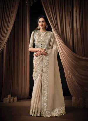 Look Attractive These Designer Party Wear Fancy Saree in Fine Colored.These Saree Are Zari Organza Satin And Blouse Soft Satin is Fabricated.Its Beautified Fancy Sequance Embroidery,Pearl Hand Work.