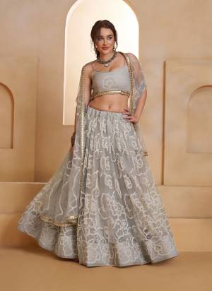 For A Different Look,Grab These Party Wear Designer Lehenga in All Over Pretty Colored Pair With Blouse And Dupatta.These Lehenga Choli And Dupatta is All Over Butterfly Net Base Fabric With Designer Tone To Tone Thread,Sequance Embroidery Work.