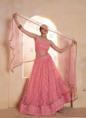 For A Different Look,Grab These Party Wear Designer Lehenga in All Over Pretty Colored Pair With Blouse And Dupatta.These Lehenga Choli And Dupatta is All Over Butterfly Net Base Fabric With Designer Tone To Tone Thread,Sequance Embroidery Work.