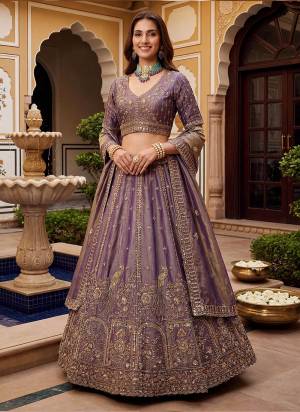 For A Fancy Designer Look,Grab These Lehenga Choli With Dupatta in Fine Colored.These Lehenga And Choli Are Fendy Organza Silk And Dupatta Are Fabricated On Fendy Organza Silk Pair.Its Beautified With Fancy Jari,Sequance Embroidery,Crystal Hand Work. 