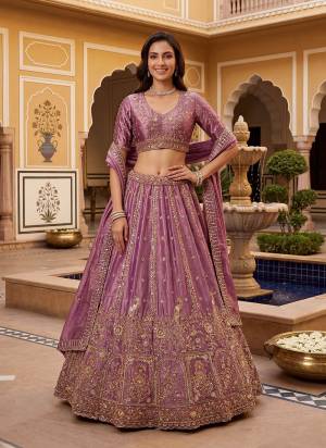 For A Fancy Designer Look,Grab These Lehenga Choli With Dupatta in Fine Colored.These Lehenga And Choli Are Fendy Organza Silk And Dupatta Are Fabricated On Fendy Organza Silk Pair.Its Beautified With Fancy Jari,Sequance Embroidery,Crystal Hand Work. 