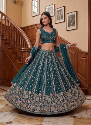 For A Fancy Designer Look,Grab These Lehenga Choli With Dupatta in Fine Colored.These Lehenga And Choli Are Fendy Organza Silk And Dupatta Are Fabricated On Fendy Organza Silk Pair.Its Beautified With Fancy Jari,Sequance,Multy Thread,Dori Embroidery Work. 