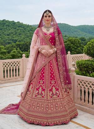 For A Fancy Designer Look,Grab These Lehenga Choli With 2 Dupatta in Fine Colored.These Lehenga And Choli Are Silk And Dupatta Are Fabricated On Soft Net Pair.Its Beautified With Fancy Peacock Figure Jari,Multy Thread,Dori Embroidery,Diamond Work. 