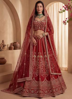 For A Fancy Designer Look,Grab These Lehenga Choli With 2 Dupatta in Fine Colored.These Lehenga And Choli Are Gadhwal Silk And Dupatta Are Fabricated On Net Pair.Its Beautified With Fancy Chapat Jari,Sequance,Multy Thread,Dori Embroidery,Crystal Hand Work. 