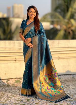 Garb These Party Wear Saree in Fine Colored.These Saree And Blouse is Fabricated On Paithani Silk.Its Beautified With Weaving Gold Jari, Peacock Paithani Meenakari Pallu Designer.
