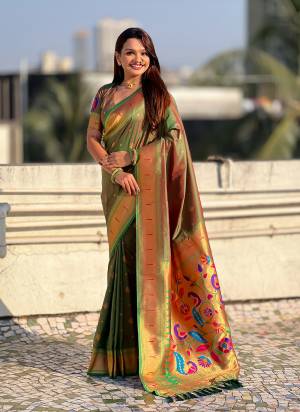 Garb These Party Wear Saree in Fine Colored.These Saree And Blouse is Fabricated On Paithani Silk.Its Beautified With Weaving Gold Jari, Peacock Paithani Meenakari Pallu Designer.