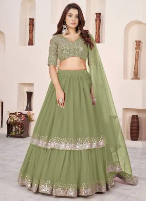 For A Designer Look,Grab These Party Wear Lehenga Choli in Fine Colored.These Lehenga And Blouse Are Fabricated On Georgette Pair With Dupatta Are Soft Net.Its Beautified With Designer Jari,Sequance Embroidery Work.