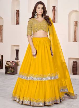For A Designer Look,Grab These Party Wear Lehenga Choli in Fine Colored.These Lehenga And Blouse Are Fabricated On Georgette Pair With Dupatta Are Soft Net.Its Beautified With Designer Jari,Sequance Embroidery Work.