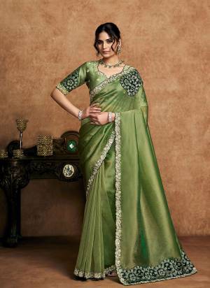 Look Attrective These Designer Party Wear Saree in Fine Colored.These Saree Are Zari organza Satin Silk And Blouse Raw Satin Silk is Fabricated.Its Beautified Desiger Embroidery,Pearl,Stone Work.