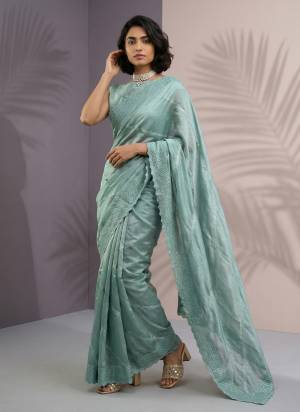 Garb These Party Wear Saree in Fine Colored.These Saree And Blouse is Fabricated On Rasberry Silk.Its Beautified With Heavy Designer Embroidery Laheriya Work.