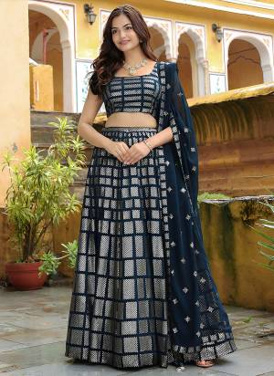For A Designer Look,Grab These Lehenga Choli in Fine Colored.These Lehenga And Blouse Are Fabricated On Georgette Pair With Dupatta Are Georgette.Its Beautified With Thread,Sequance Embroidery Work.