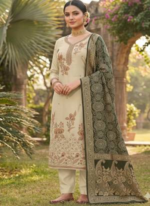 Looking These Suit in Fine Colored Pair With Bottom And Dupatta.These Top Are Cotton Silk And Dupatta Are Fabricated On Banarasi Jacquard Pair With Dull Santoon Bottom.Its Beautified With Designer Printed, Hand Work.