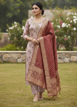 Looking These Suit in Fine Colored Pair With Bottom And Dupatta.These Top Are Cotton Silk And Dupatta Are Fabricated On Banarasi Jacquard Pair With Dull Santoon Bottom.Its Beautified With Designer Printed, Hand Work.