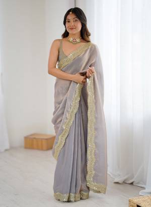 Attractive These Fancy Party Wear Saree in Fine Two Tone Colored.These Saree Are Fendy Satin Silk And Blouse is Fendy Satin Silk Fabricated.Its Beautified With Two Tone Color,Designer Sequance,Jari Embroidery Cut Work.