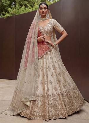 For A Fancy Designer Look,Grab These Lehenga Choli With 2 Dupatta in Fine Colored.These Lehenga And Choli Are Silk And Dupatta Are Fabricated On Net Pair.Its Beautified With Fancy Jari,Various Sequance Embroidery,Crystal Pipe Hand Work. 