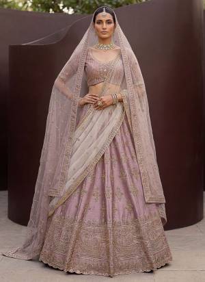 For A Fancy Designer Look,Grab These Lehenga Choli With 2 Dupatta in Fine Colored.These Lehenga And Choli Are Silk And Dupatta Are Fabricated On Net Pair.Its Beautified With Fancy Jari,Various Sequance Embroidery,Crystal Pipe Hand Work. 