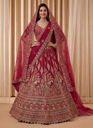 For A Fancy Designer Look,Grab These Lehenga Choli With 2 Dupatta in Fine Colored.These Lehenga And Choli Are Silk And Dupatta Are Fabricated On Net Pair.Its Beautified With Fancy Peacock Figure,Dori, Jari,Thread Embroidery,Diamond Work. 